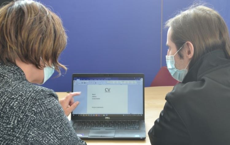 Young person receiving advice on their CV