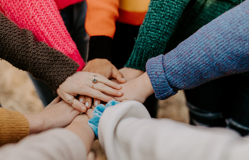 Image of hands together in circle