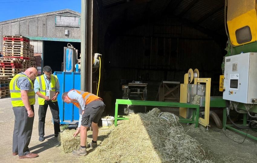 Councillor Jones viewing hay products
