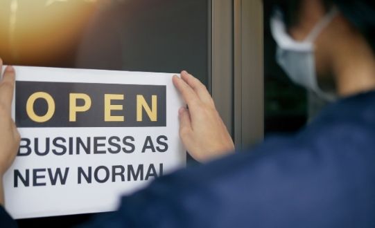 Image of open business as new normal sign